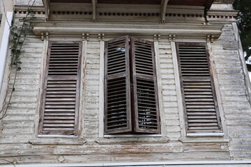 Fototapeta na wymiar selective focus. Old building with shutters in Buyukada. Turkey Istanbul