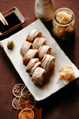 White eel sushi set on a clay plate