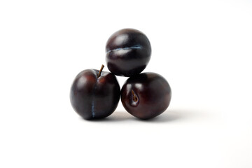 Black cherry plums isolated on white background
