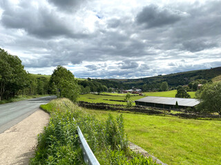 Landscape view, near the, Huddersfield Road, looking toward, Delph, with fields, farms and houses near, Delph, Oldham, UK