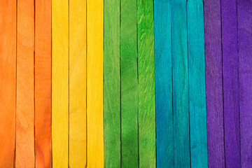 Above photo of rainbow colorful wooden sticks as colors of LGBT flag