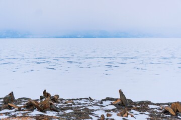 Obraz premium Pyramids of stones in winter on Lake Baikal.