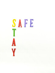 Wooden Alphabet " STAY SAFE" isolated with white background. Care concept.