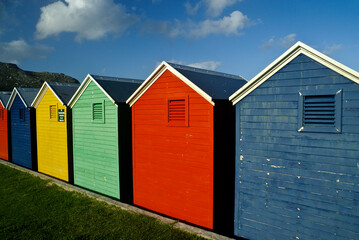 Fototapeta na wymiar Colorful changing houses on the beach, Fish Hoek, Cape Peninsula, South Africa