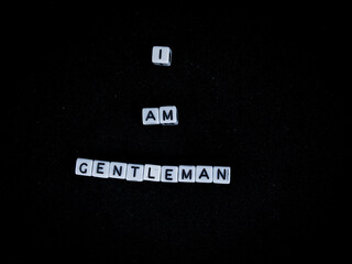"I AM GENTLEMAN" word made of cube beads isolated with black background.
