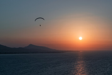 Parachuting - Paragliding in sunset