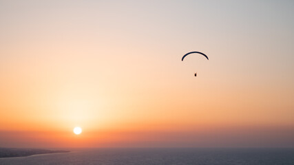 Parachuting - Paragliding in sunset