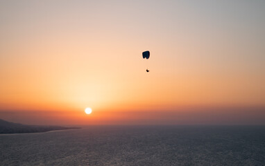 Parachuting - Paragliding in sunset
