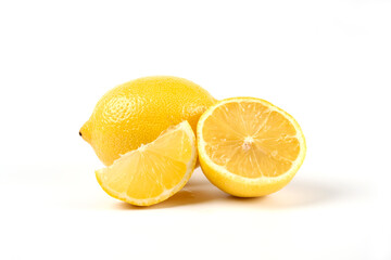 Yellow fresh lemon cut into pieces macro view