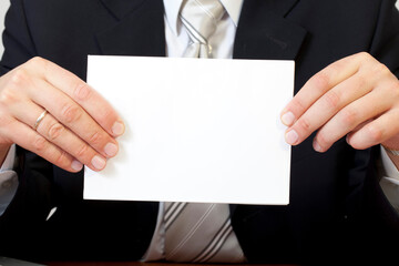 a clean sheet of white paper in male hands