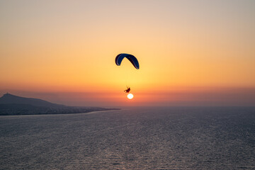 Parachuting - Paragliding in sunset