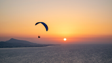 Parachuting - Paragliding in sunset
