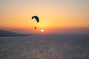 Parachuting - Paragliding in sunset