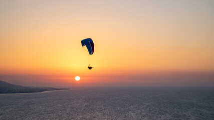 Parachuting - Paragliding in sunset