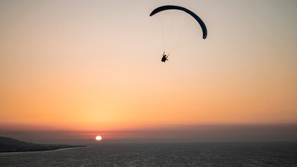 Parachuting - Paragliding in sunset