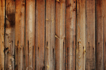 Old wooden fence in ocher colors