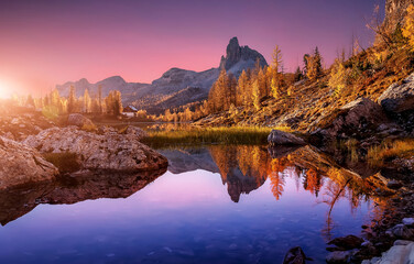Majestic sunset over mountain lake. Wonderful Nature landscape during sunset. Beautiful colored...