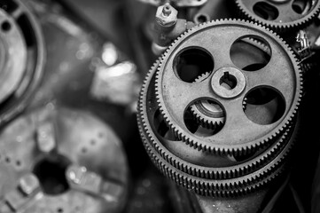 Machinery gears with oil stains and signs of use Lay the pile waiting for cleaning and maintenance. To make the machine work efficiently
