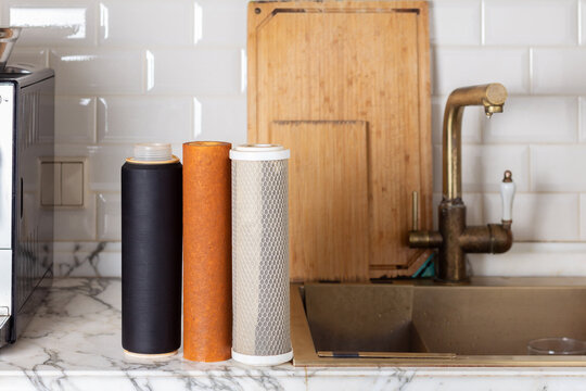 Old filter cartridges for cleaning tap water in the kitchen