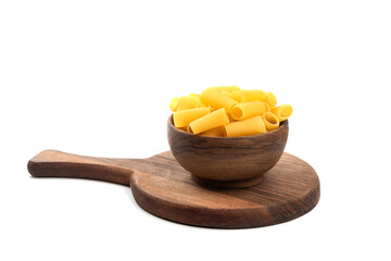 Wooden bowl of raw tube pasta isolated on white background