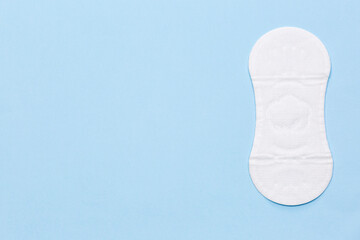 White sanitary napkin on the blue background, medical banner
