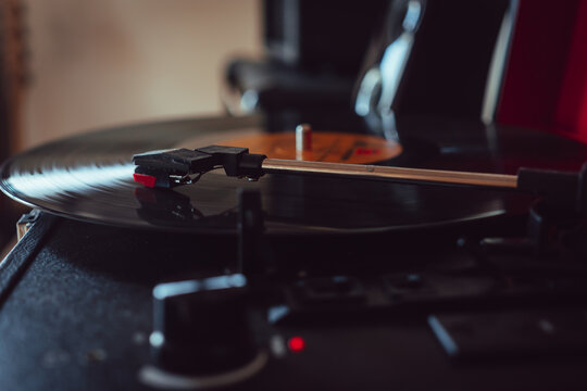 Closeup view headshell of portable record player.