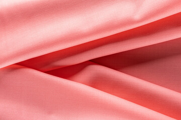 evenly draped bright pink fabric for tailoring, background