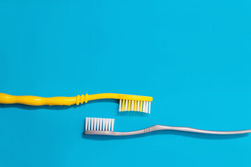 two toothbrushes on a blue background copy the space. the concept of oral hygiene, dental care