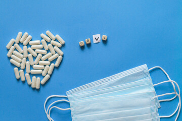 Back to normal. Hand turns dice and changes the expression "corona life" to "normal life", white heart, heart made of pills