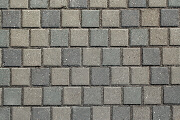Obraz premium The texture of concrete tiles. background of the sidewalk of the city. the texture of the sidewalk of the street.