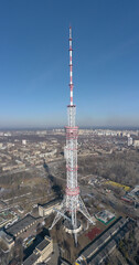 Obraz premium telecommunication tower with many transmitters and receivers for various radio frequencies and data transmission, including 5G and satellite at blue sky