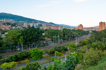Fototapeta na wymiar A Landscape of the Medellin City in the Afternoon Surrounded of Trees, Buildings, Mountains