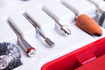 Sander attachments in white container close up
