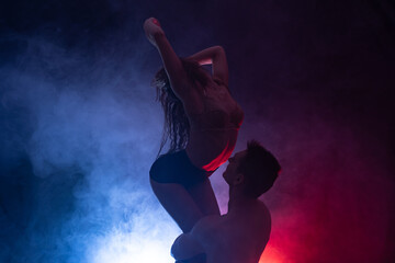 silhouette of a loving couple in a close embrace of passion and attraction. relationship and sex...