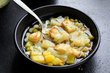 soup vegetable first course meal broth, potatoe, cauliflower, pasta no meat vegetarian or vegan portion on the table snack top view copy space food background
