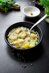 soup vegetable first course meal broth, potatoe, cauliflower, pasta no meat vegetarian or vegan portion on the table snack top view copy space food background