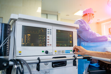 Artificial lung ventilation monitor in the intensive care unit. Unrecognizible doctor near medical equipment. Ventilation of the lungs with oxygen. COVID-19 and coronavirus identification. Pandemic.