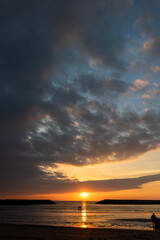 People on the beach enjoying the beautiful sunset in Latin America