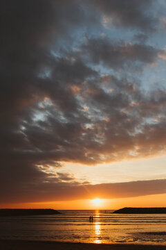 People on the beach enjoying the beautiful sunset in Latin America