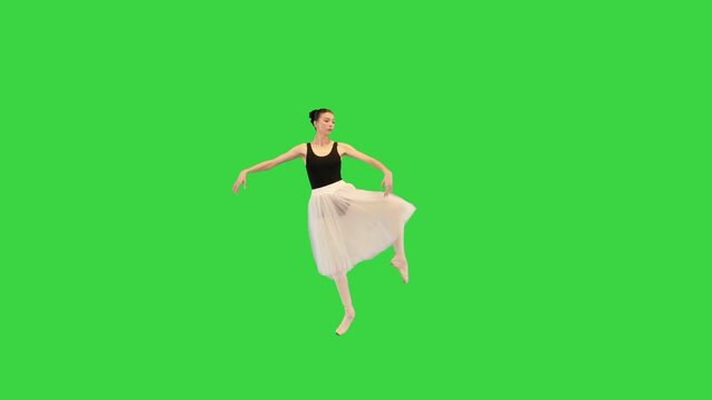 Ballerina in a romantic dudu doing some basic dancing moves on a Green Screen, Chroma Key.