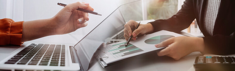 businesswoman hand using smart phone,mobile p payments online shopping,omni channel,digital tablet docking keyboard computer at office in sun light