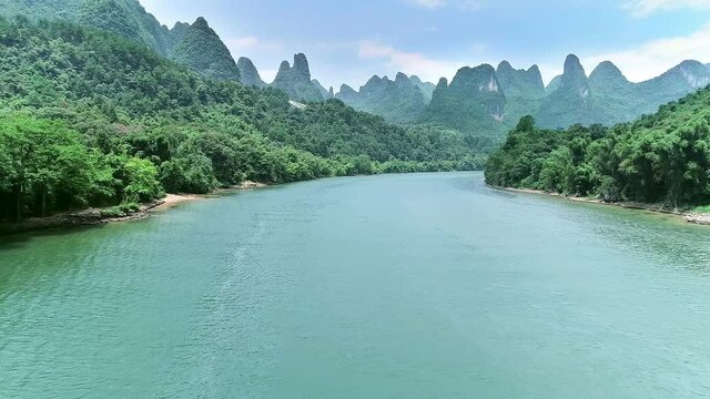Aerial view of Li River with ripples and karst landforms in Guangxi 