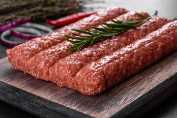 Fresh raw mince for grilled kebab with spices and herbs