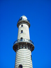 Fototapeta na wymiar Der Leuchtturm an der Ostseeküste in Warnemünde 