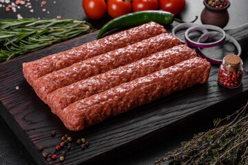 Fresh raw mince for grilled kebab with spices and herbs