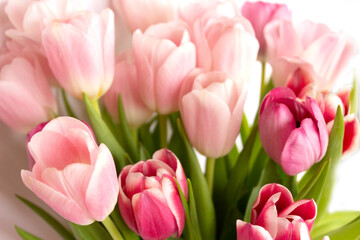 Bouquet of tender pink tulips. Concept, symbol of the holiday. Floral arrangement of spring flowers