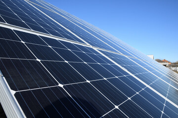 Obraz premium Solar panels against blue sky background.Against The Deep Blue Sky in suny weather