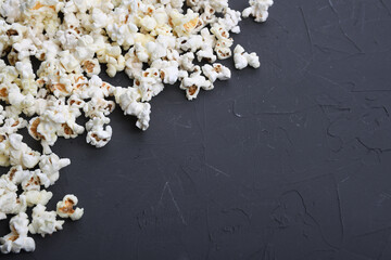 Salted popcorn on a concrete, stone background. Top view