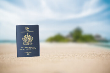 Saint Kitts passport on the beach sand ,Space for writing	