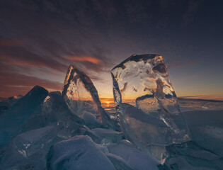 Ice sheets on frozen lake Baikal. Landscape photo of sunrise on the lake. 